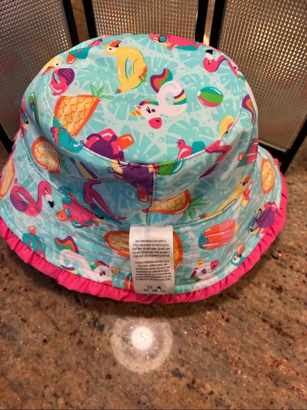 UV Skinz Reversible Bucket Hat Pink side/tropical pattern side UPF 50+, size 6